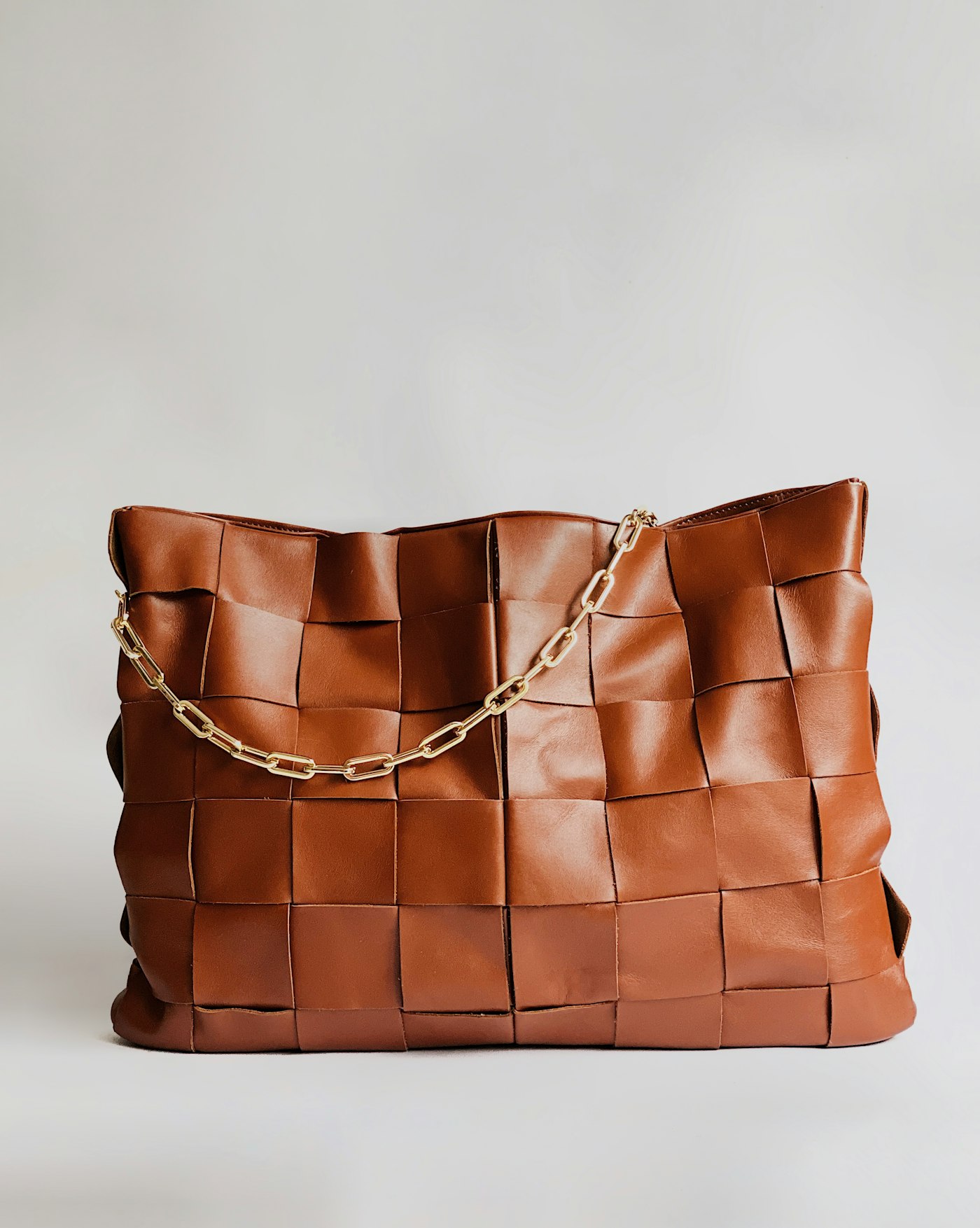 Ladies cognac woven leather tote handbag